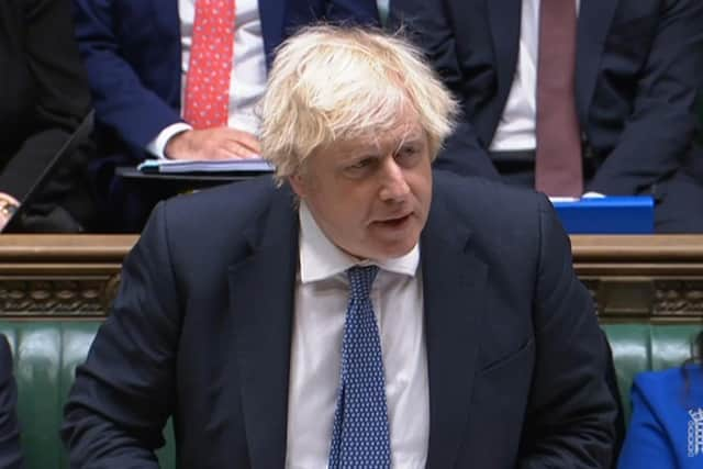 Prime Minister Boris Johnson speaks during Prime Minister's Questions in the House of Commons earlier today