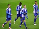 The Latics players ready themselves for the Shrewsbury game
