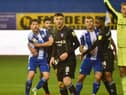 Callum Lang gets reacquainted with former Latics skipper Sam Morsy