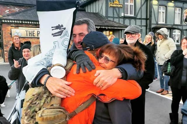 Alex Rigby was greeted by the parents of Elliot Hennell at the finish line