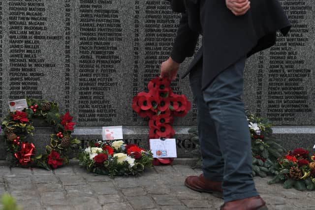 Tributes were placed at a memorial naming all the men who died