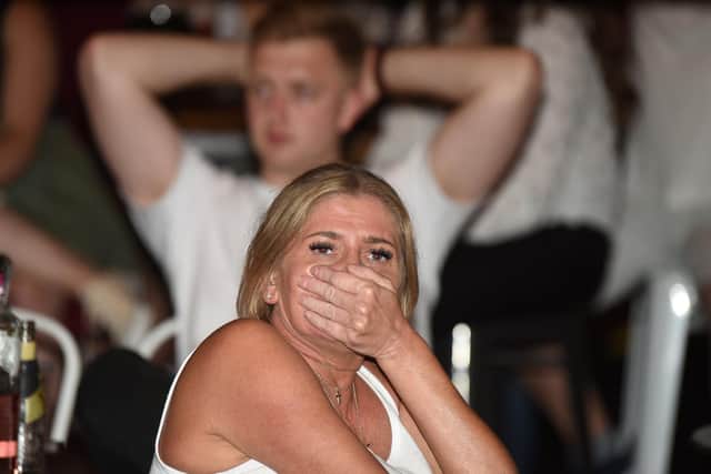 England fans in Wigan show their shock at the Euros final result