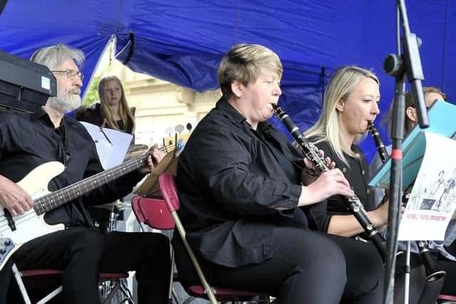 The Really Awful Orchestra performing in Wigan town centre