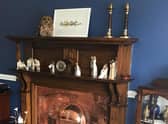 A couple from Southport had a shock when they heard a commotion coming from their living room and found a tawny owl sat on the fireplace!
