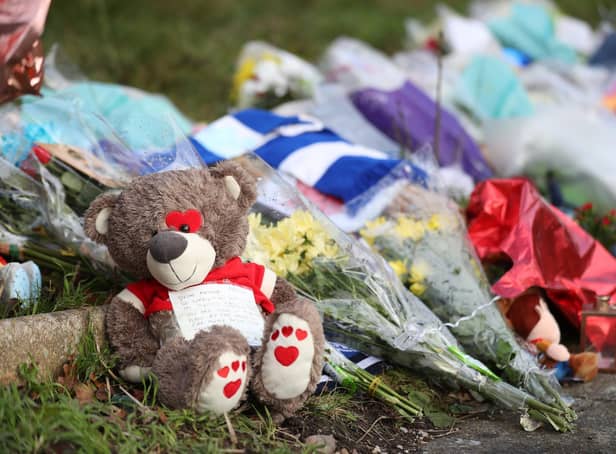 Tributes left outside the home of Arthur Labinjo-Hughes in Solihull