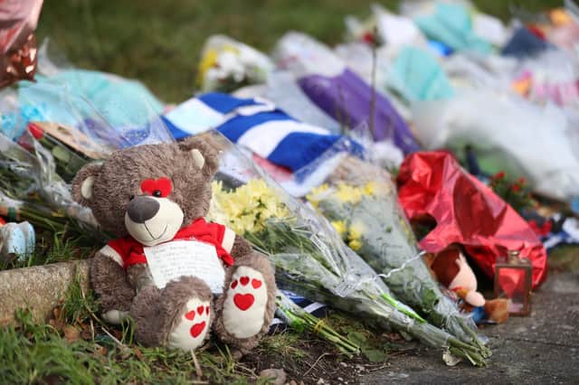 Tributes left outside the home of Arthur Labinjo-Hughes in Solihull