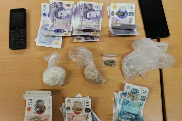 Heroin, crack cocaine and just under £1,000 cash were found in the car