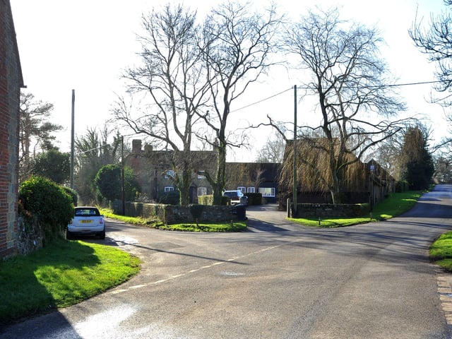 The Green retains its characteristic triangular shape and the asymmetrical design of its houses.