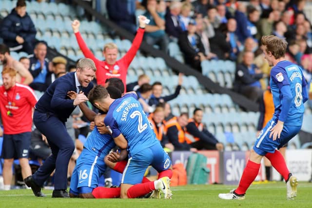 Posh manager Grant McCann celebrates a goal for Posh against Wigan in September, 2017.
