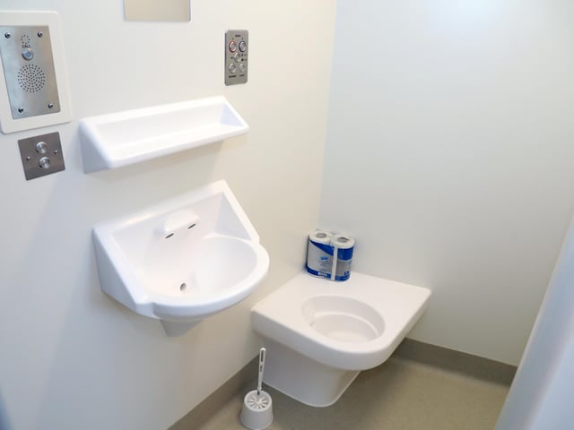 Each cell has a sink, toilet and shower operated by wall switches and buttons