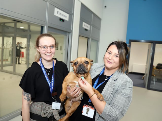 Bella the pat dog is one of six pooches that work in the prison l-r Charlotte Baynes (children and family relationships manager), Bella, Gemma Westley (family support worker) actively encourage the men to build family ties