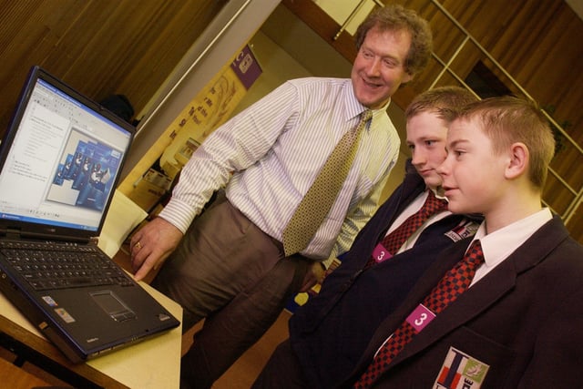 George Gilmore, IT trainor from Westcare, talks about hospital IT services to Lisneal College pupils Andrew McCord and Jason Barton. (3103PG07)