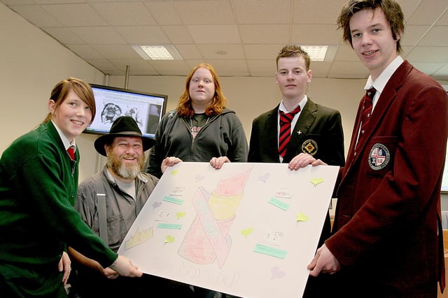 1003e
lecturer Ernest Adams (seated), Game Design Consultant, with students from local schools who took part in a half day computer games designing session at the University of Ulster, Magee Campus. From left are Ciara McCormick, St. Cecilia's College, Scott Olphert, Lisneal College, Martin Crawley, St. Brigid's College and Kyle McSparron, Foyle and Londonderry College.