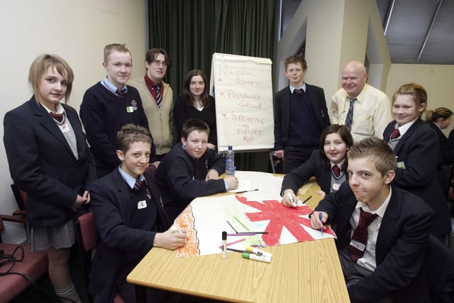 Pupils from St. Peter's High School and Lisneal College participating in the See Me - See You Cross Community Project organised by the Verbal Arts Centre. Seated, from left, are Aaron Scanlon, Lee Taylor, Lindsay Morrison and Aaron Burton. Back, from left, are Chelsea Carr, Rory McDonald, Ciaran Flanagan, Verbal Arts Centre, Miss Claire Bell, teacher, Conor Gallacher, Mr. Hugh Green, teacher, and Kate Rutherford. (1403C10)