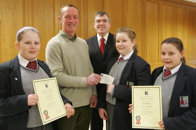 Lisneal College students Vicki King, Emma Smallwoods and Keir Pomeroy presenting a cheque for £1500 which was raised by students to Robin Crockett of the Tear Fund.  Also in photo is school primcipal David Funston.  (0704JB11)