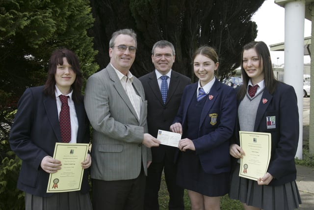 Lisneal College pupils, from left, Emma Armstrong, Dawn Whylie and Jade Marston, presenting £1,725.40 to Richard Moore, director, Children in Crossfire. The money was raised the pupils through various events. Included is Mr. David Funston, principal. (2804C29)