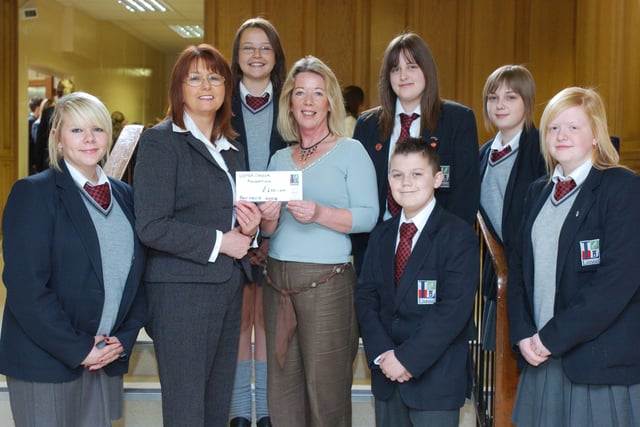 Pupils from Lisneal College who have helped raise £600 to support Joan Simpson, fourth left, who is climbing Mount Everest for the Ulster Cancer Foundation. The money was raised by Easter egg sales, selling cookies, and giving away their last Rollo's. Included, from left, Lauren January, Sylvia Lucy, Ulster Cancer Foundation development officer, Emma Johnston, Cheryl Robinson, Scott McLaughlin, Amy Adair, and Rachael Walker. (0905PG01)
