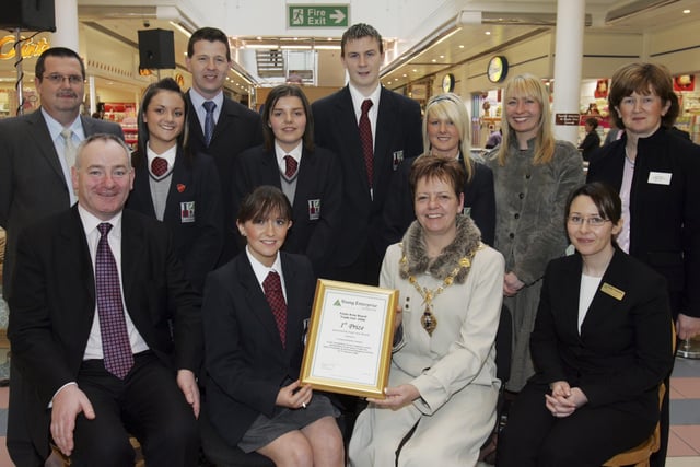 The Mayor, Councillor Lynn Fleming, presenting First Prize at the Young Enterprise Trade Fair to Lucy Wilson, managing director, Occasions, Lisneal College. Included at front are Mark Durkan, MP, and Nicola Moses, Young Enterprise. Back, from left, are Rob Jefferson, Northern Bank, Sarah Hawthorne, Shaun Temple, Invista, judge, Courtney Piper, Stephen Grieve, Kieva Jewell, Miss Evana Stuart, teacher, and Carol Wilson, Northern Bank. (3101C05)