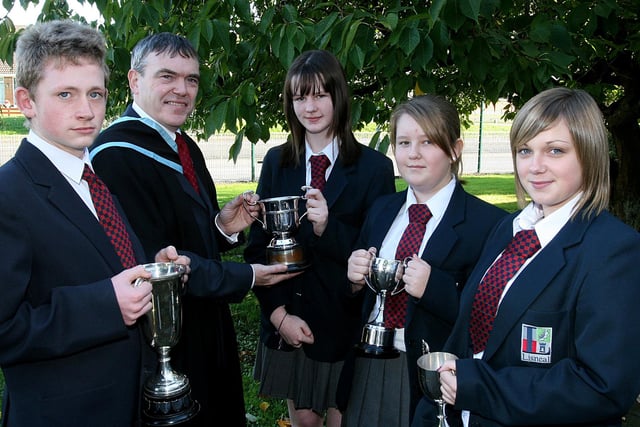 David Funston, Headmaster, with pupils who received awards at Lisneal College annual Prise Giving.   From left are Andrew McCord, who collected the Commitment prize, at the Lisneal College annual Prize Giving, with pupils who received Academic Achievement awards. Donna Scroggie, Year 11, Emma Smallwoods, Year 8 and Amy Adair, Year 10.  LS44-509MT.