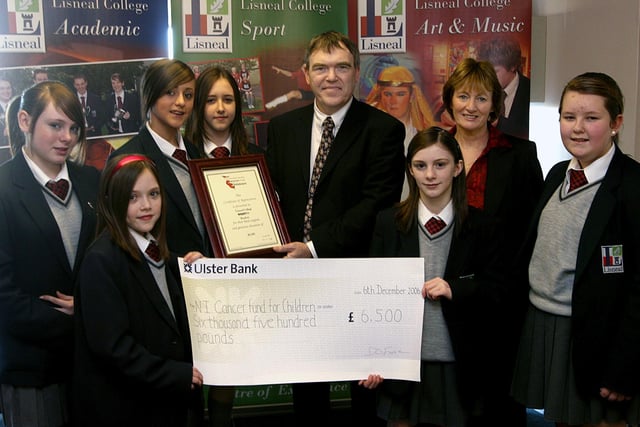Pupils at Lisneal College raised £6,500 through a sponsored Read-on which was handed over to the college principal David Funston, for the Northern Ireland Cancer Fund for Children. Representing the pupils are (from left), Charlotte Pilling, Yasmin Rowan, Kendra McMullan, Gabrielle Rowan, Laura Kydd and Emma Smallwoods.   Included is Elizabeth Mills, teacher and charity co-ordinator.  LS50-519MT.