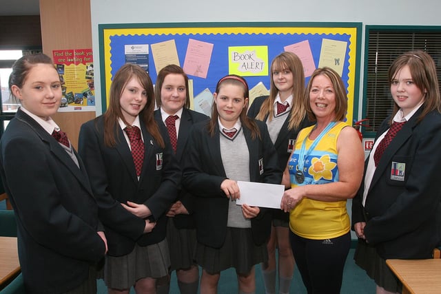 Pupils at Lisneal College handing over a cheque for £400 to Joan Simpson, laboratory technician at the college, who was sponsored when she competed in the Great North Run in Newcastle, in aid of Marie Curie Cancer Support.  The pupils (from left), Sarah Buchanan,  Charlotte Pilling, Alex McGowan, Samantha Norris, Kimberley Hardie and Nikita Hornby, raised the money at the school through a weekly cookie sale. LS47-502MT.