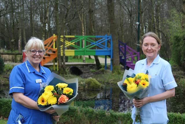 Kay and Susan with flowers given in recognition of their long service