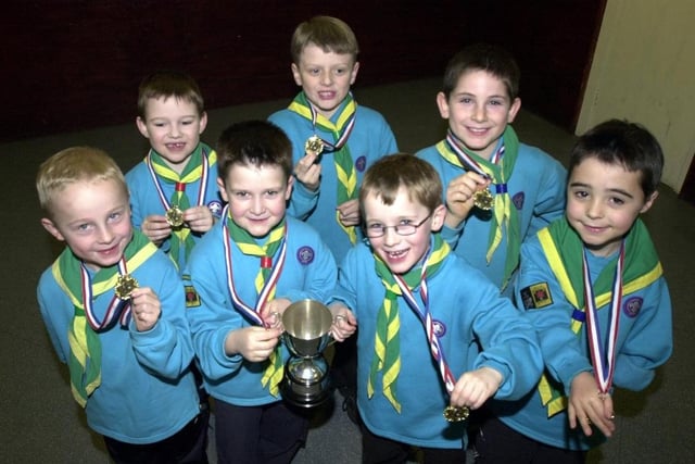 2003 - The 1st Orrell Beaver Scouts celebrate winning a trophy and medals.