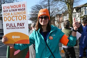 Junior doctor Behnaz Pourmohammadi on the picket line outside Wigan Infirmary during industrial action earlier this month