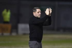 Leam Richardson salutes the fans at Crewe