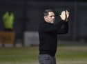 Leam Richardson salutes the fans at Crewe