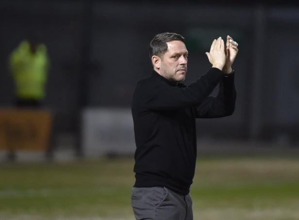 Leam Richardson salutes the fans at Crewe