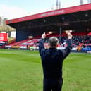 Ryan Lowe salutes the Latics fans before his first game in charge