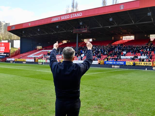 Ryan Lowe salutes the Latics fans before his first game in charge