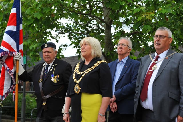 Mayor Coun Marie Morgan, council leader David Molyneux and consort Coun Clive Morgan pay their respects