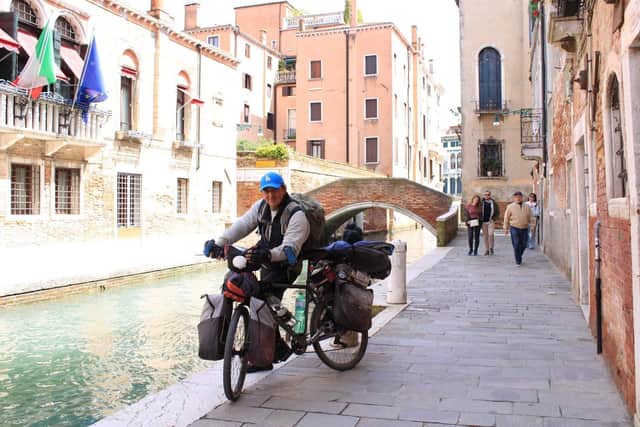 Sam cycling in Italy