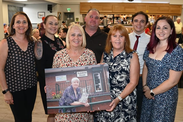 Event organisers hold a photo of Barbara.