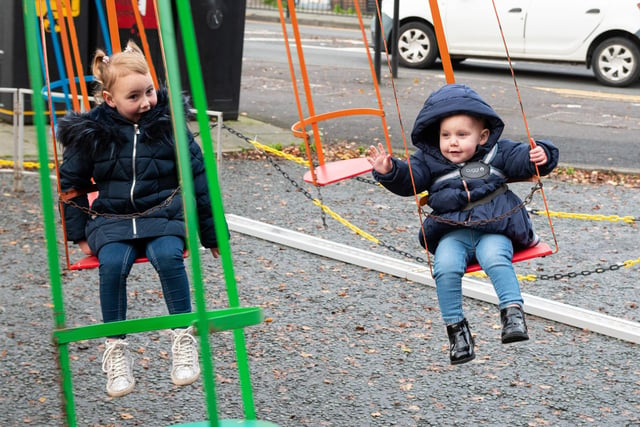 Children having fun on the swings at Pemberton Christmas Market