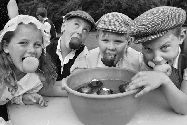 Pupils of Rectory CE Primary School, Garswood, who were trying their hand and mouths at Victorian games such as bob apple for the day in May 1989.