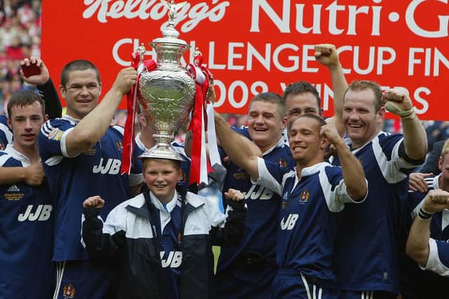 Andy Farrell celebrates with the team and his son Owen after winning 2002 Challenge Cup over St Helens
