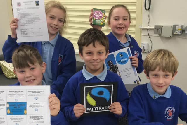 All Saints Primary School's Fairdo group proudly display their certificates