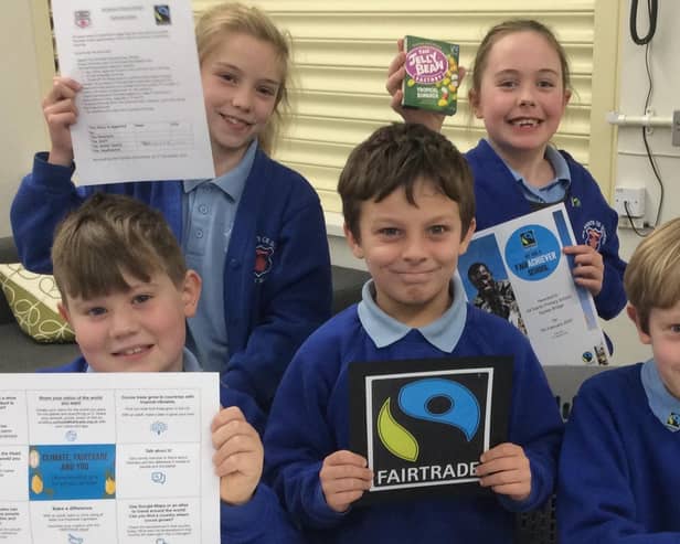 All Saints Primary School's Fairdo group proudly display their certificates