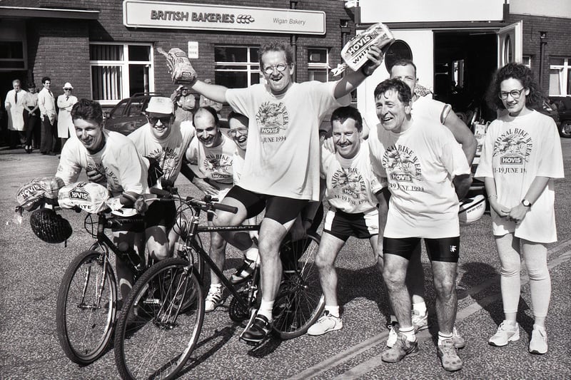 Ski jump hero Eddie the Eagle Edwards stops off at British Bakeries in Cale Lane, New Springs, with some of his fellow cyclists on an 800 mile charity bike ride during Hovis National Bike Week on Monday 13th of June 1994. The cyclists were taking part in the ride to raise funds for SPARKS a charity that helped children through sport. Amongst the riders was local lad, Stephen Bennett, on the left.