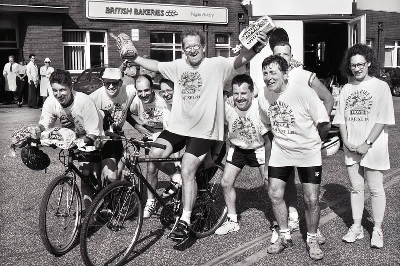 Ski jump hero Eddie the Eagle Edwards stops off at British Bakeries in Cale Lane, New Springs, with some of his fellow cyclists on an 800 mile charity bike ride during Hovis National Bike Week on Monday 13th of June 1994.  The cyclists were taking part in the ride to raise funds for SPARKS a charity that helped children through sport.  Amongst the riders was local lad, Stephen Bennett, on the left.
