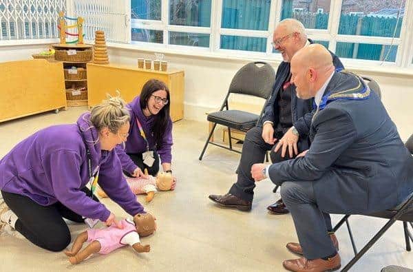 Malcolm Bell and Ian Green learning some baby CPR !