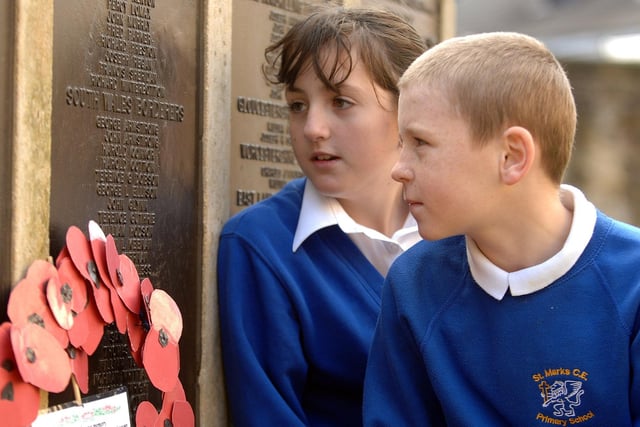 RETRO 2007 - Pupils from St Marks school visited the Remembrance memorial outside Wigan Parish Church to hold their own memorial service. Pictured are Bethany West and Luke Evan .