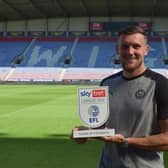 Charlie Wyke with his Player of the Month award