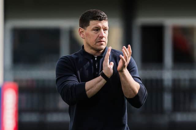 Matt Peet applauds the Wigan Warriors fans