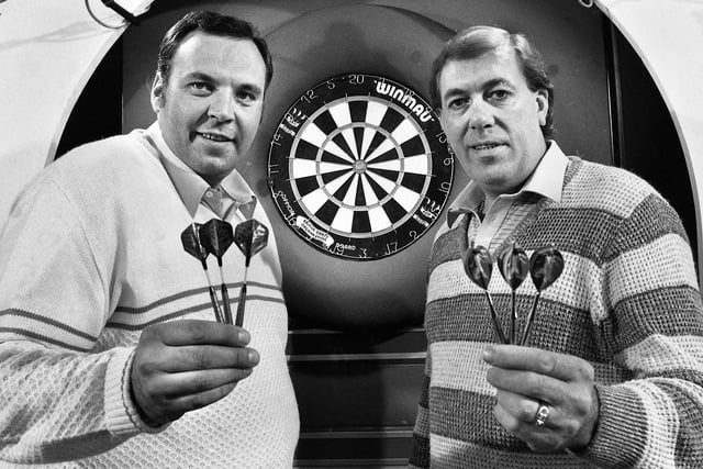 World darts stars Cliff Lazarenko, left, and John Lowe ready to compete at the LUT buses depot in Atherton.