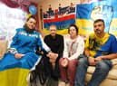 A reunited Ukrainian family talk about the past few months as Standish residents Svitlana Vordzhkina, left, and husband Ruslan Vordzkin, right, welcomed her father Sergii Shygimaga and step-mother Ganna Shygimaga, who fled the war in Ukraine earlier this year.