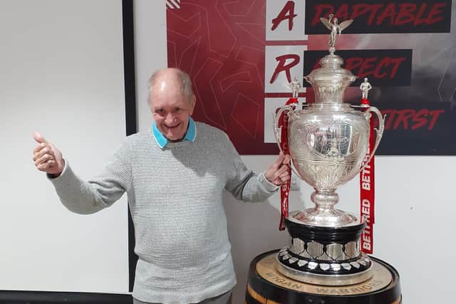 Wigan fan Peter Adshead was given the chance to hold the Challenge Cup